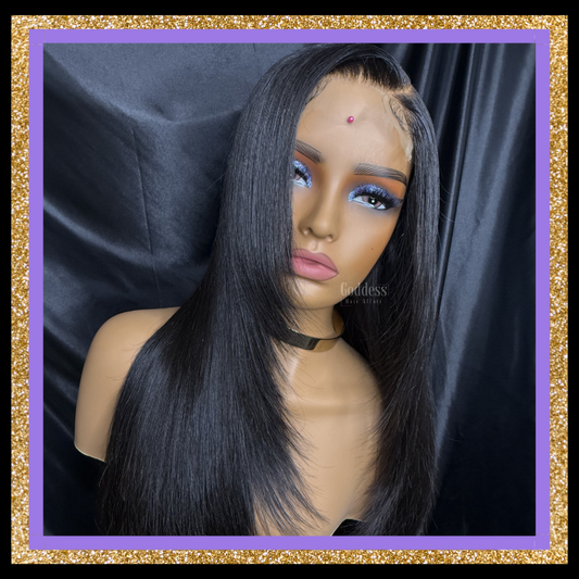 Black lace front wig on a mannequin head with a dark background