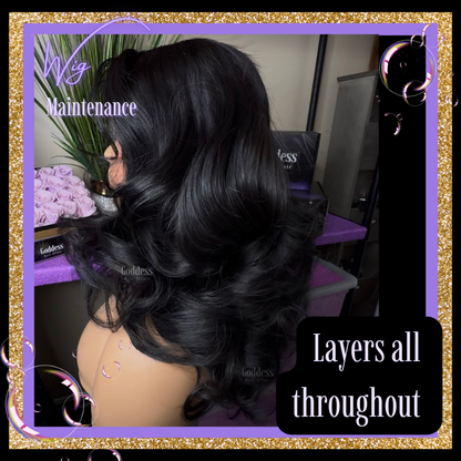 Black wig on a mannequin head with text 'Layers all throughout'