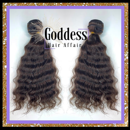 A photo of two Raw Natural Wave Bundles of hair extensions with a label that reads 'GODDESS HAIR AFFAIR'.