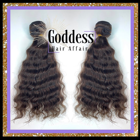 A photo of two Raw Natural Wave Bundles of hair extensions with a label that reads 'GODDESS HAIR AFFAIR'.