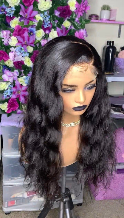  a wig with natural waves, styled in a manner that highlights the product's texture and length.
