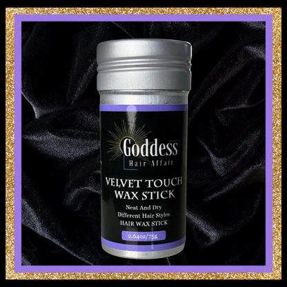 Goddess Hair Affair Velvet Touch Wax Stick on a dark fabric background