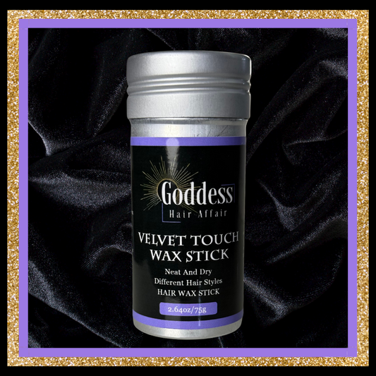 Goddess Hair Affair Velvet Touch Wax Stick on a dark fabric background